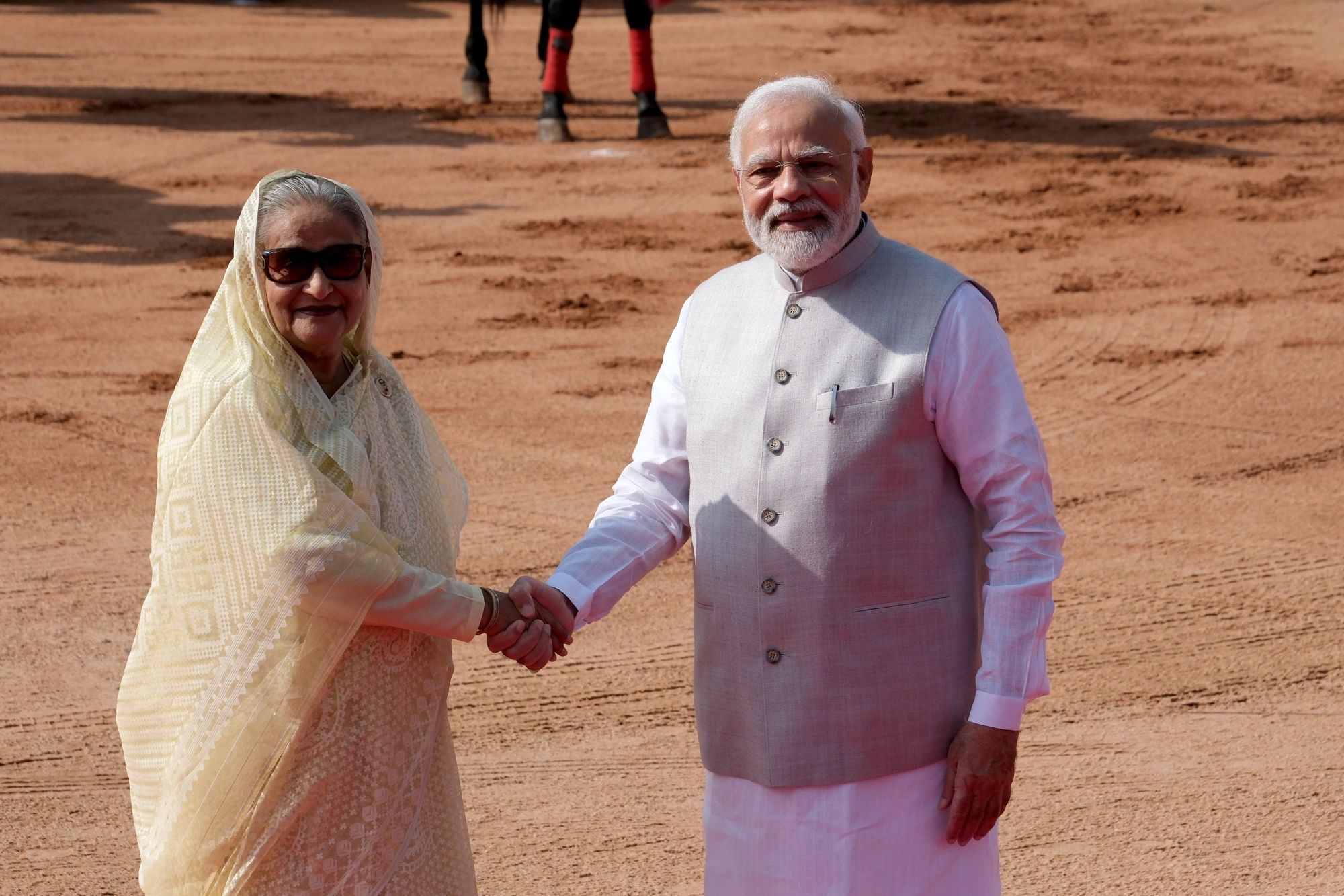 Prime Minister Narendra Modi (right) greets Bangladesh PM Sheikh Hasina (left), during a ceremonial reception at Rashtrapati Bhawan in New Delhi on Tuesday, (Bloomberg) Prime Minister Narendra Modi (right) greets Bangladesh PM Sheikh Hasina (left), during a ceremonial reception at Rashtrapati Bhawan in New Delhi on Tuesday, (Bloomberg)