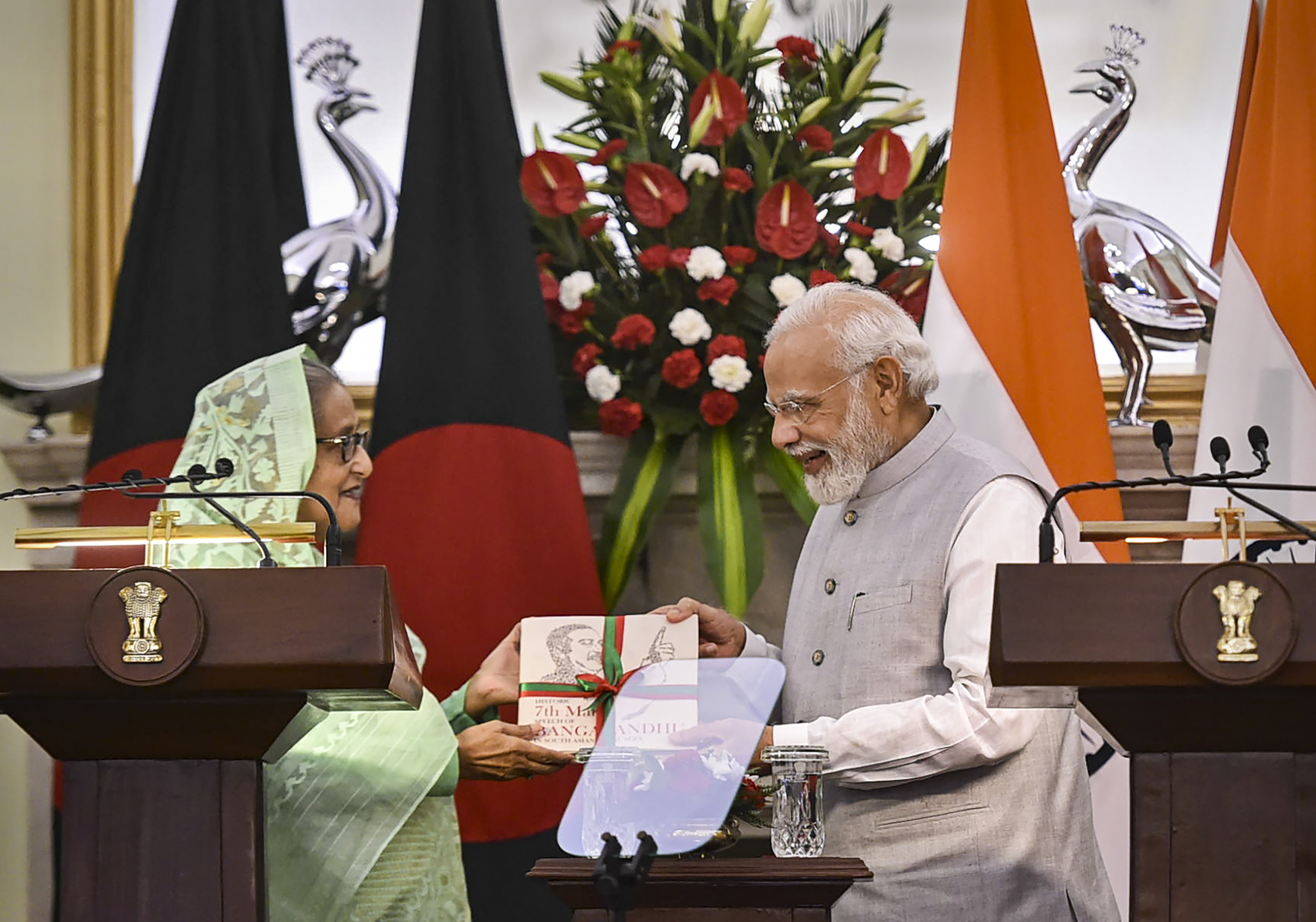 Prime Minister Narendra Modi (right) with his Bangladeshi counterpart Sheikh Hasina (left) during the release of a joint statement after their meeting, at Hyderabad House in New Delhi. (PTI) Prime Minister Narendra Modi (right) with his Bangladeshi counterpart Sheikh Hasina (left) during the release of a joint statement after their meeting, at Hyderabad House in New Delhi. (PTI)
