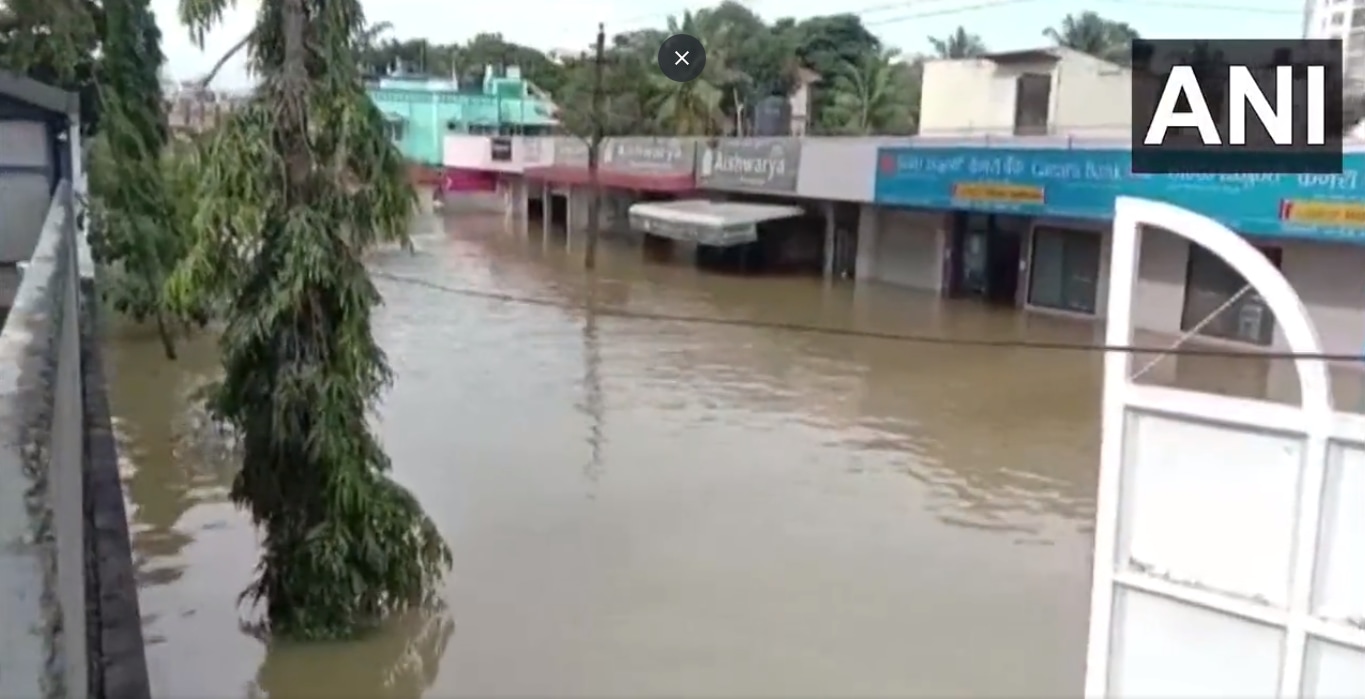 A road in Bengaluru's Sarjapur area filled up with water from heavy rain. (ANI) A road in Bengaluru's Sarjapur area filled up with water from heavy rain. (ANI)