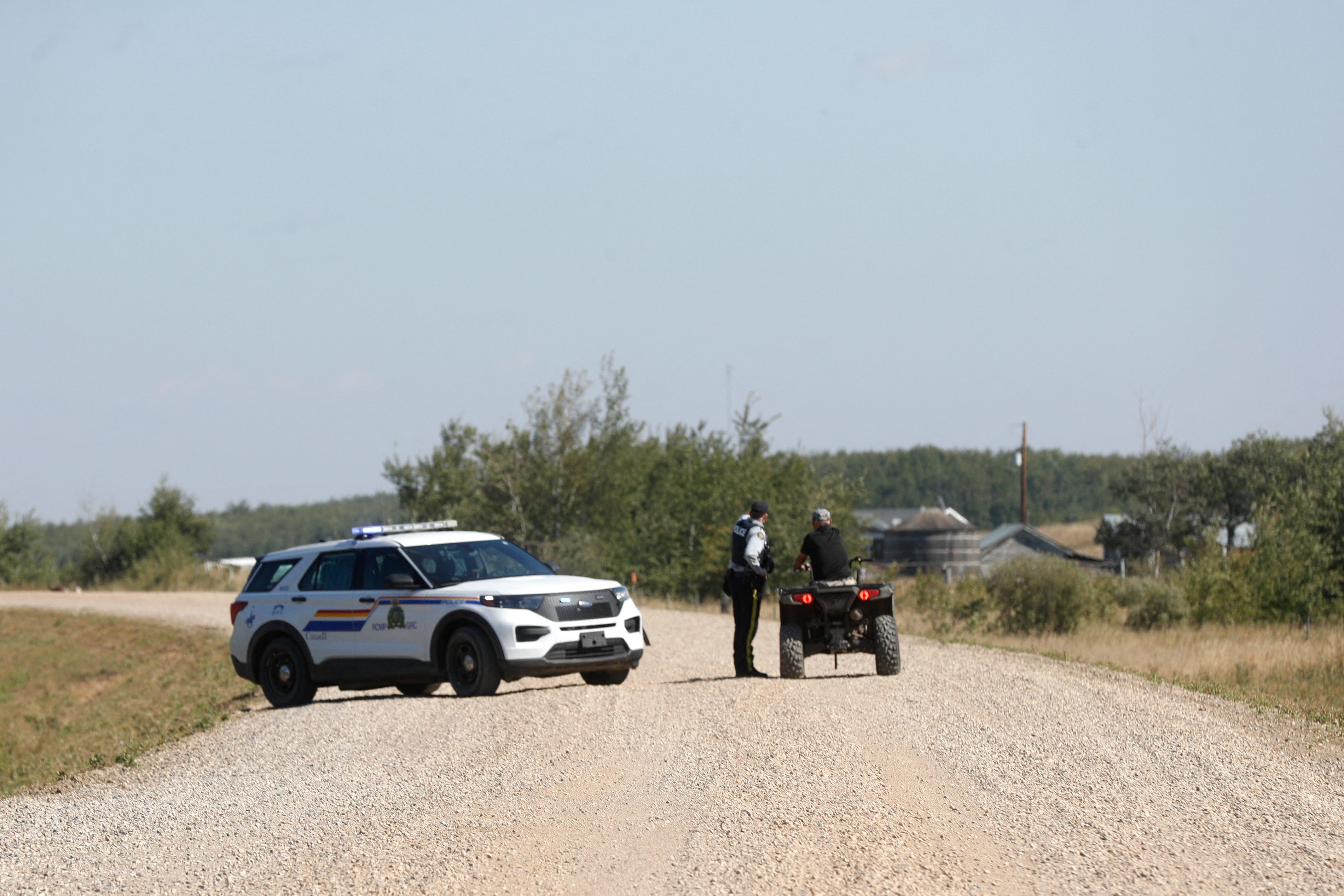 Police deal with a situation following a possible sighting of the second person of interest in the stabbings that occurred at the James Smith Cree Nation indigenous community and the town of Weldon, in Canada on September 6, 2022. (Photo by LARS HAGBERG/AFP) Police deal with a situation following a possible sighting of the second person of interest in the stabbings that occurred at the James Smith Cree Nation indigenous community and the town of Weldon, in Canada on September 6, 2022. (Photo by LARS HAGBERG/AFP)