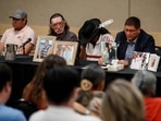 Mark Arcand (R), brother of stabbing victim Bonnie Burns, and Brian (2nd R), husband of Bonnie, pause behind pictures of Bonnie during a news conference in Saskatoon, Saskatchewan, Canada on September 7, 2022. (Photo by Cole BURSTON/AFP) Mark Arcand (R), brother of stabbing victim Bonnie Burns, and Brian (2nd R), husband of Bonnie, pause behind pictures of Bonnie during a news conference in Saskatoon, Saskatchewan, Canada on September 7, 2022. (Photo by Cole BURSTON/AFP)