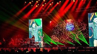 In the photos shared by Kapil Sharma from his live show in Melbourne, Kapil can be seen standing on the stage in front of the jam-packed stadium. During the show, he paid a tribute to late singer Mohammad Rafi as he sung his song Parda hai Parda from the movie, Amar Akbar Anthony. In the photos shared by Kapil Sharma from his live show in Melbourne, Kapil can be seen standing on the stage in front of the jam-packed stadium. During the show, he paid a tribute to late singer Mohammad Rafi as he sung his song Parda hai Parda from the movie, Amar Akbar Anthony.