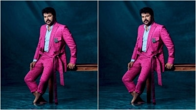 Mammootty’s formal fashion diaries featured a bright pink suit teamed with a pair of formal trousers of the same print. The suit came with a tie around detail at the waist. (Instagram/@mammootty)