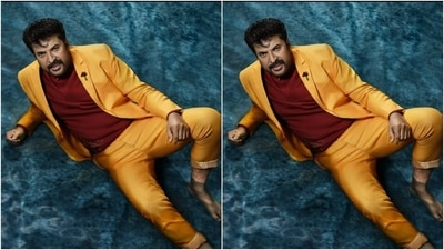 Mammootty rocked a yellow suit with his feet dipped in water as he layered it with a maroon turtleneck T-shirt. (Instagram/@mammootty)