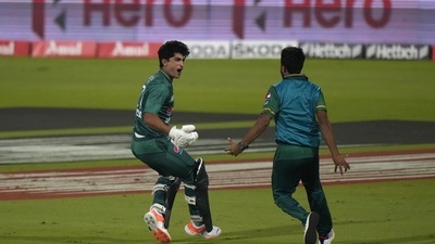 Pakistan's Naseem Shah, left, celebrates after hitting two consecutive sixes to win the T20 cricket match of Asia Cup against Afghanistan, in Sharjah. (AP) Pakistan's Naseem Shah, left, celebrates after hitting two consecutive sixes to win the T20 cricket match of Asia Cup against Afghanistan, in Sharjah. (AP)