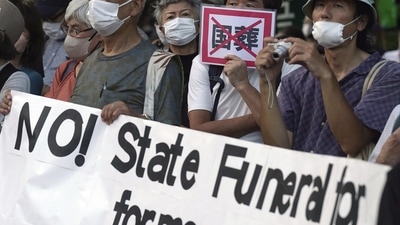 State Funeral For Assassinated Shinzo Abe: People protest against former Prime Minister Shinzo Abe's state funeral. (AP) State Funeral For Assassinated Shinzo Abe: People protest against former Prime Minister Shinzo Abe's state funeral. (AP)