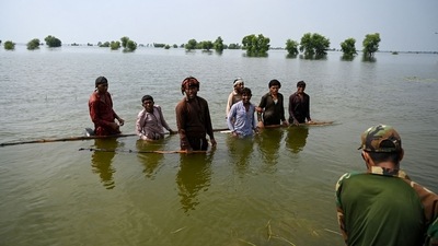 Pakistan Floods: Pakistan's Naval personnel rescue flood-affected people. (AFP) Pakistan Floods: Pakistan's Naval personnel rescue flood-affected people. (AFP)