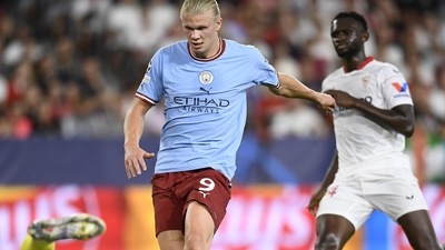 Erling Haaland scores his side's third goal during the group G Champions League match between Sevilla and Manchester City in Seville (AP) Erling Haaland scores his side's third goal during the group G Champions League match between Sevilla and Manchester City in Seville (AP)
