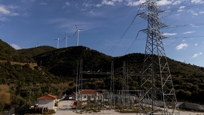 Greece Energy Crisis: Wind turbines are seen on a hill in front of a power station in Greece, (Reuters)