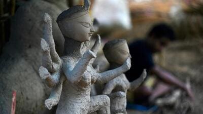 An artisan clays an idol of the Hindu Goddess Durga at a workshop ahead of Durga Puja festival in New Delhi (AFP) An artisan clays an idol of the Hindu Goddess Durga at a workshop ahead of Durga Puja festival in New Delhi (AFP)