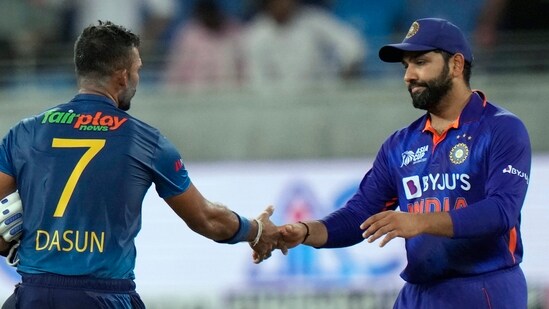 India's captain Rohit Sharma shake hands with Sri Lanka's captain Dasun Shanaka to congratulate him after Sri Lanka won the match&nbsp;(AP)