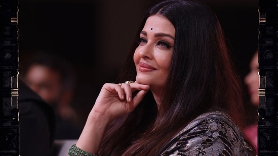 Aishwarya Rai attended the trailer launch event of Ponniyin Selvan in Chennai on Tuesday evening. The actor was dressed in black ethnic wear. Aishwarya greeted director Mani Ratnam with a hug and he patted her back. Aishwarya also touched Rajinikanth's feet before he pulled her up and gave her a hug. In the film, Aishwarya will be seen in dual roles --one of queen Nandini, the princess of Pazhuvoor, and the other of Mandakini Devi.