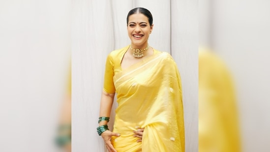 Kajol paired her 6-yards with a matching yellow blouse featuring a plunging neckline and high collar.(Instagram/@kajol)