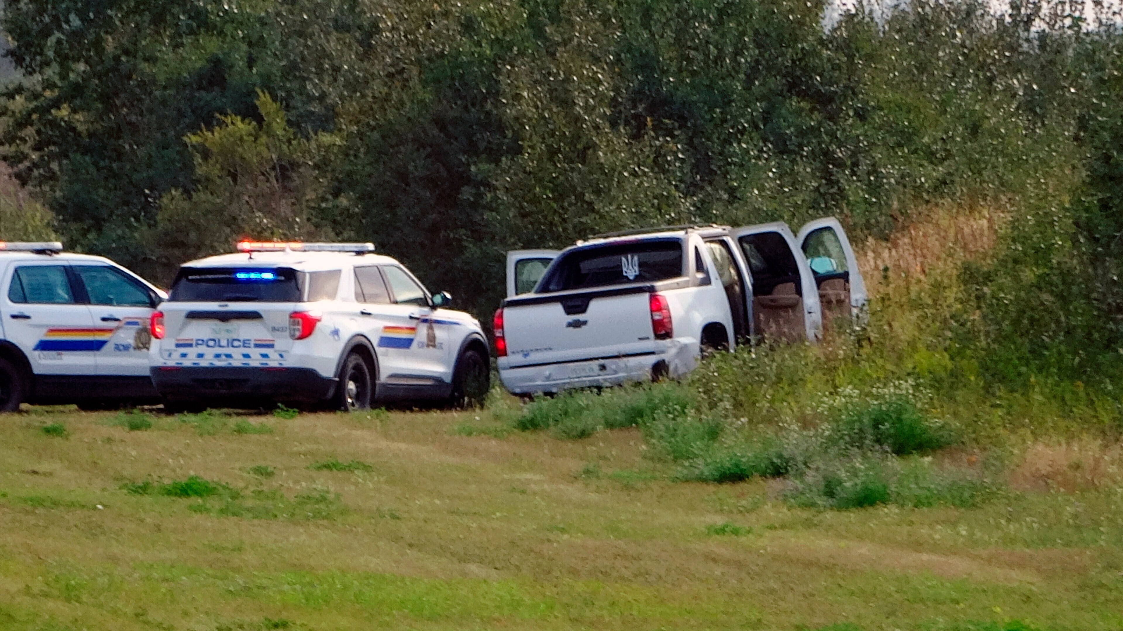 Police and investigators are seen at the side of the road outside Rosthern, Saskatchewan on Wednesday, September 7, 2022. (Kelly Geraldine Malone/The Canadian Press via AP) Police and investigators are seen at the side of the road outside Rosthern, Saskatchewan on Wednesday, September 7, 2022. (Kelly Geraldine Malone/The Canadian Press via AP)