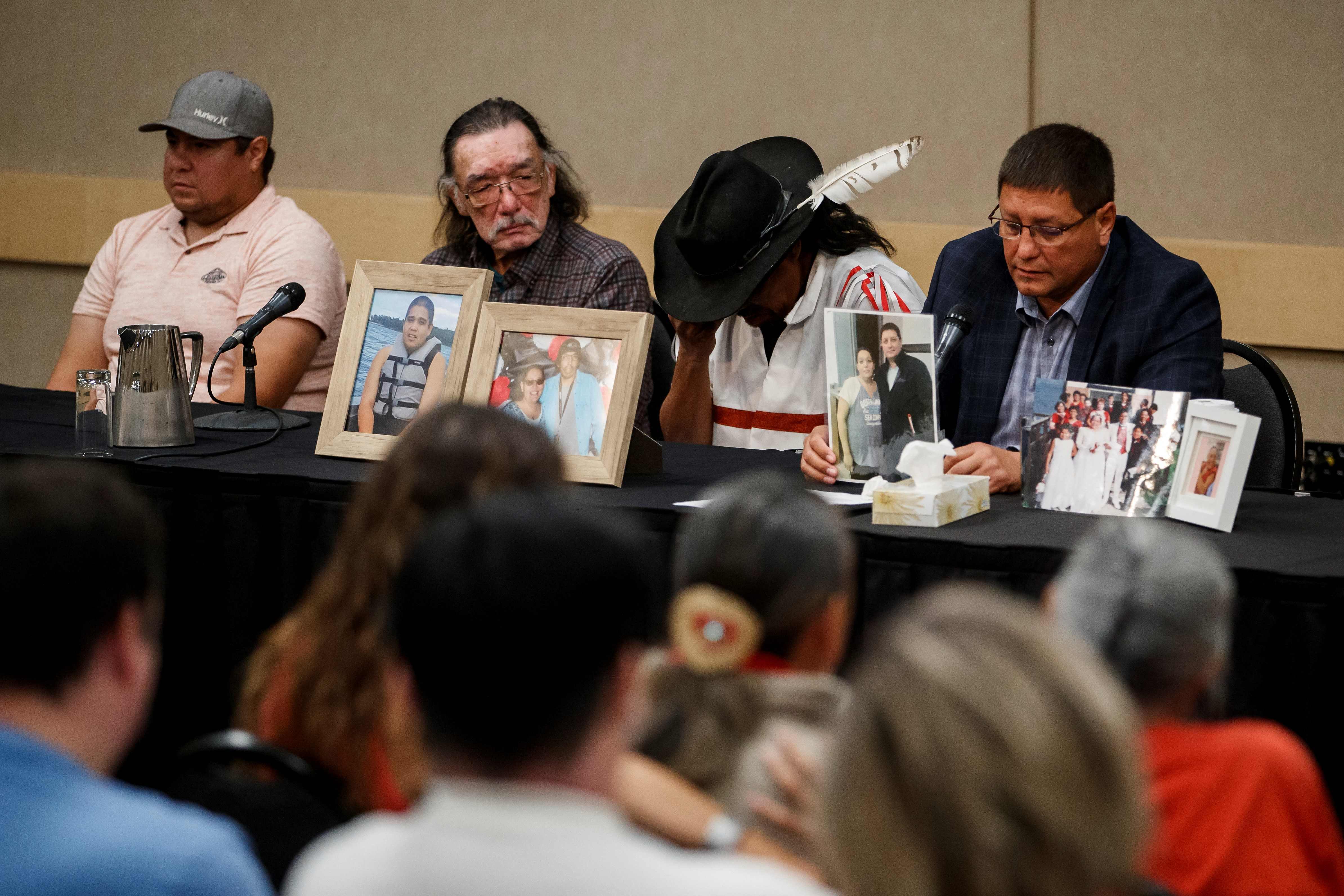 Mark Arcand (R), brother of stabbing victim Bonnie Burns, and Brian (2nd R), husband of Bonnie, pause behind pictures of Bonnie during a news conference in Saskatoon, Saskatchewan, Canada on September 7, 2022. (Photo by Cole BURSTON/AFP) Mark Arcand (R), brother of stabbing victim Bonnie Burns, and Brian (2nd R), husband of Bonnie, pause behind pictures of Bonnie during a news conference in Saskatoon, Saskatchewan, Canada on September 7, 2022. (Photo by Cole BURSTON/AFP)