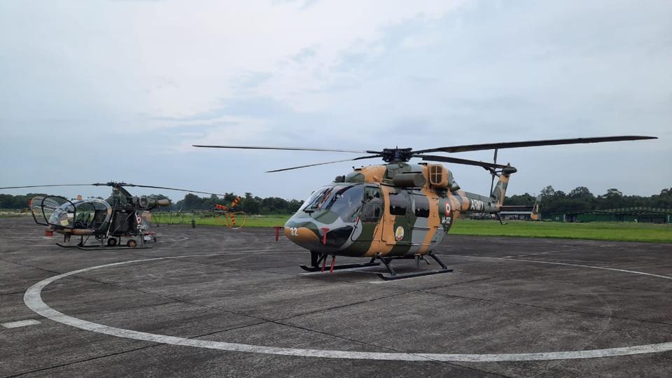 A Cheetah and an advanced light helicopter (right) at the army’s Dinjan base in Assam on Wednesday. (HT Photo) A Cheetah and an advanced light helicopter (right) at the army’s Dinjan base in Assam on Wednesday. (HT Photo)