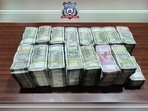 The cash seized by Bengaluru's CCB on Wednesday from three suspects. The cash seized by Bengaluru's CCB on Wednesday from three suspects.