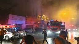 Vietnam Karaoke Bar Fire: Firefighters at the scene of a deadly fire.