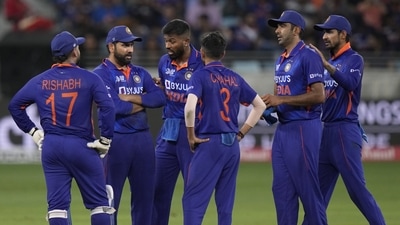 India's captain Rohit Sharma speaks to his teammates between the overs (AP) India's captain Rohit Sharma speaks to his teammates between the overs (AP)