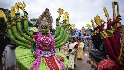 Artists dressed like Hindu deities participate in the Athachamayam procession marking the beginning of Onam festival in Kochi. (AP) Artists dressed like Hindu deities participate in the Athachamayam procession marking the beginning of Onam festival in Kochi. (AP)