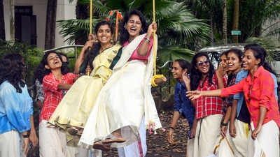 Students of Government College for Women ride a swing during Onam celebrations, in Thiruvananthapuram. (PTI) Students of Government College for Women ride a swing during Onam celebrations, in Thiruvananthapuram. (PTI)