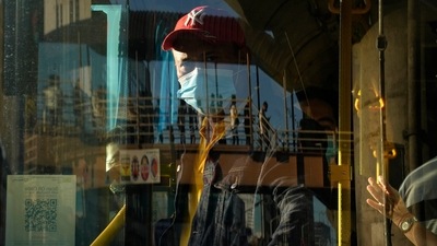 Coronavirus: A bus attendant waits for passengers at a bus stop in Manila, Philippines. (AP) Coronavirus: A bus attendant waits for passengers at a bus stop in Manila, Philippines. (AP)