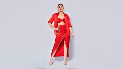 Huma Qureshi completed her look by teaming it with a red oversized shirt from Zara. (Instagram/@iamhumaq) Huma Qureshi completed her look by teaming it with a red oversized shirt from Zara. (Instagram/@iamhumaq)