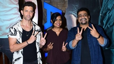 Vikram Vedha is the remake of Pushkar–Gayathri's 2017 Tamil film of the same name. Hrithik posed with the director couple at the film's trailer launch event in Mumbai on Thursday. (Varinder Chawla) 