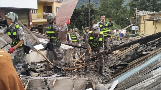 China Sichuan Earthquake: Soldiers clear debris to search for survivors at an earthquake hit Moxi Town of Luding County.
