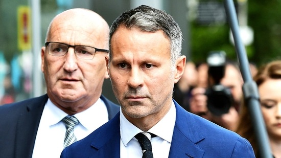 Former Manchester United footballer Ryan Giggs leaves Manchester Crown Court, in Manchester, England.(AP)