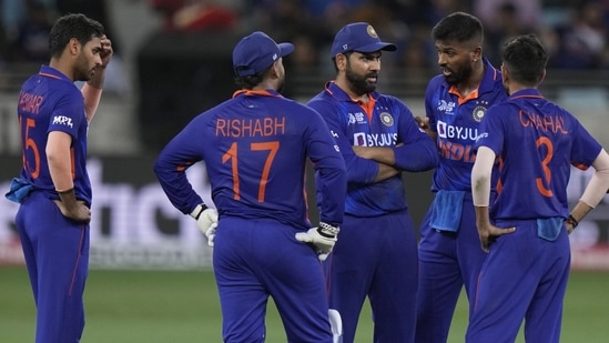 India's captain Rohit Sharma, center, interacts with his teammates(AP)