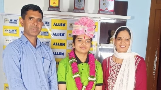 NEET topper Tanishka Yadav with her parents.