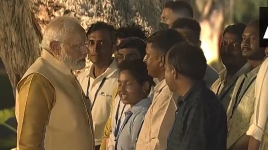 PM Modi interacts with workers involved in Central Vista project.