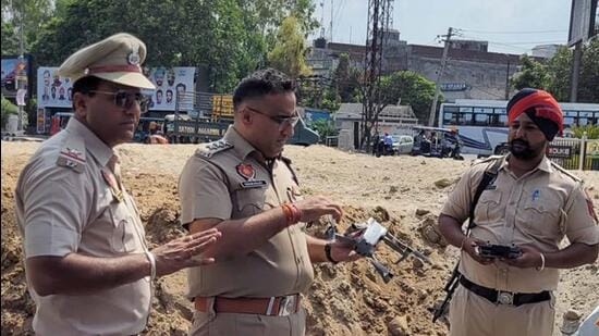 Ludhiana traffic police personnel testing the drone cameras at Jalandhar Bypass Chowk. (HT Photo)