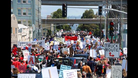 Workers at the Port of Oakland participate in a rally on June 19, 2020, calling for police reform. Thousands marched through the streets of Oakland, past the Police Dept then to City Hall. (Shutterstock)