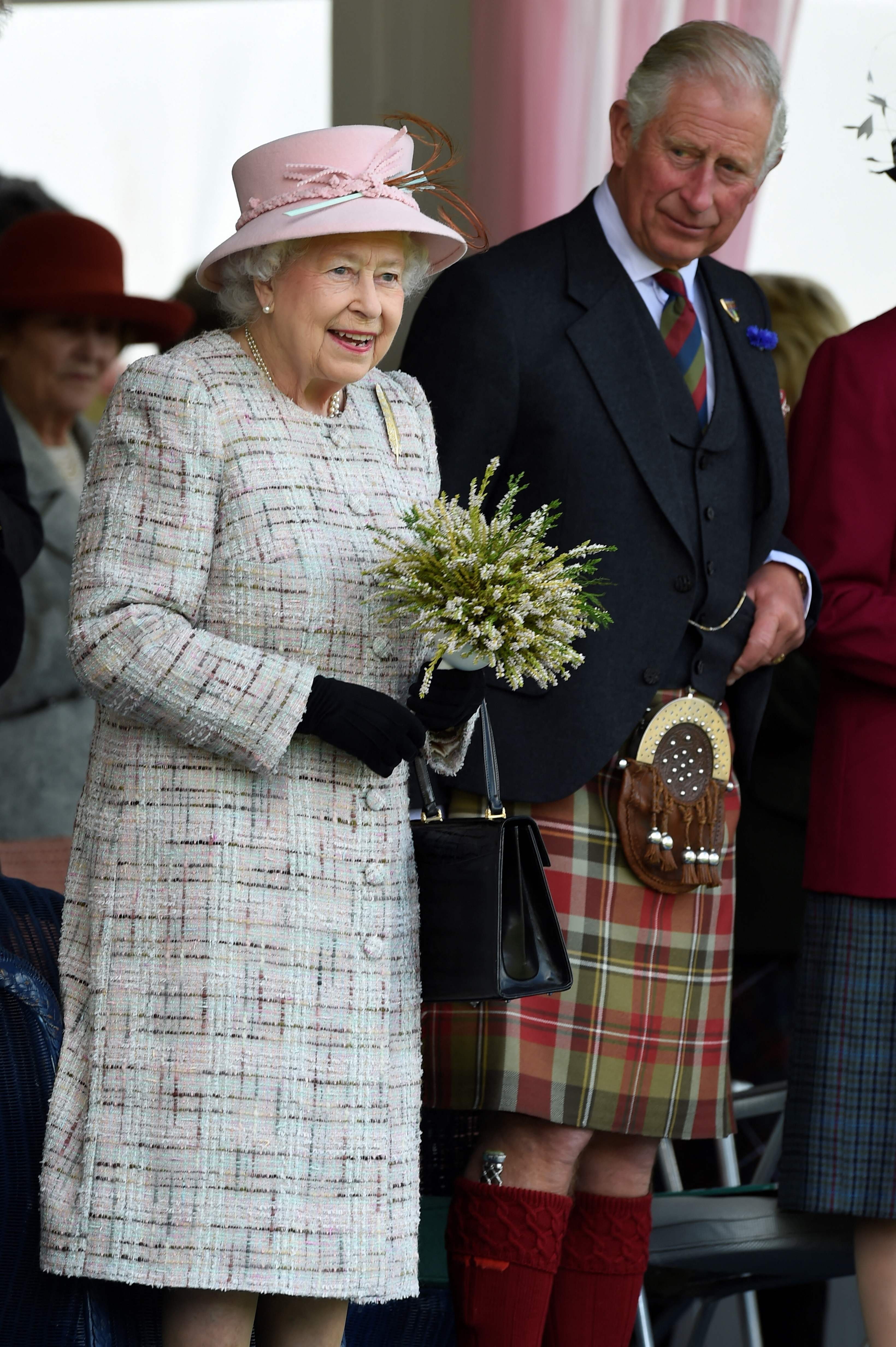 Late Britain's Queen Elizabeth II (L) and her eldest son, and country's new monarch King Charles III in this file photo taken at the annual Braemar Gathering in Braemar, central Scotland, in September 2017. (Photo by ANDY BUCHANAN/AFP)