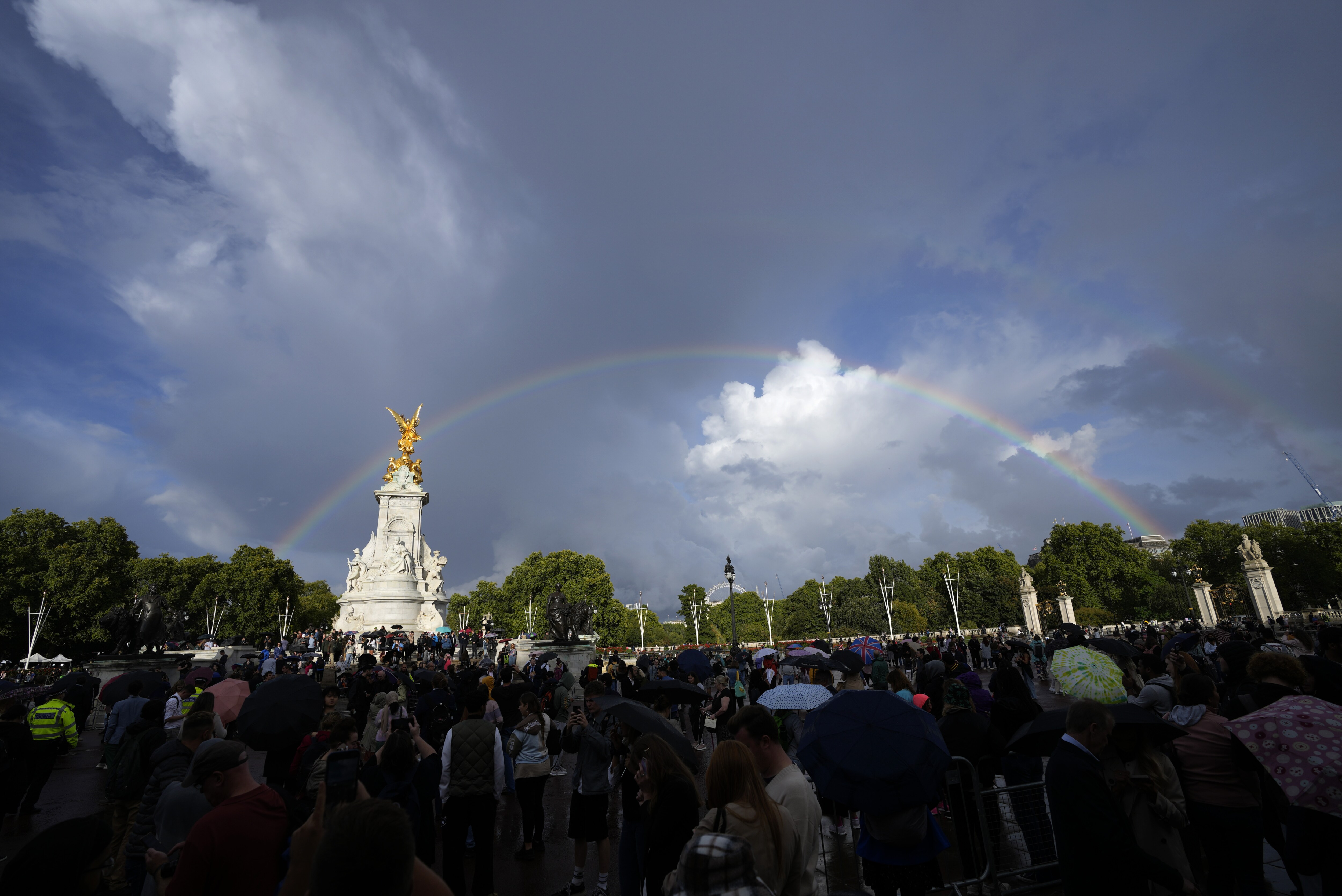 People gather outside Buckingham Palace in London as a double rainbow appears in the sky, Thursday, September. 8, 2022. (AP Photo/Frank Augstein) People gather outside Buckingham Palace in London as a double rainbow appears in the sky, Thursday, September. 8, 2022. (AP Photo/Frank Augstein)