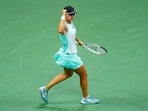 Iga Swiatek, of Poland, reacts after scoring a point against Aryna Sabalenka, of Belarus, during the semifinals of the U.S. Open tennis