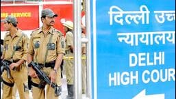 Police commandos stand guard in front of Delhi high court in New Delhi.
