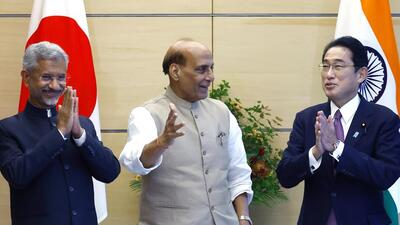 Japanese Prime Minister Fumio Kishida (right) talks with India's foreign minister S Jaishankar (left) and defence minister Rajnath Singh in Tokyo on Friday (AP) Japanese Prime Minister Fumio Kishida (right) talks with India's foreign minister S Jaishankar (left) and defence minister Rajnath Singh in Tokyo on Friday (AP)