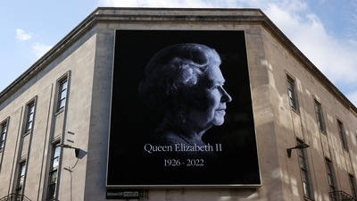 Queen Elizabeth II Passes Away: An image of late Britain Queen Elizabeth is displayed in a board in Cardiff, Britain. (Reuters)