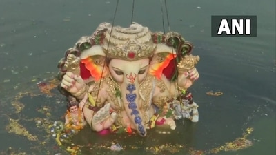 Lord Ganesh idol being immersed in water at Tank Bund Road, Hyderabad. Lord Ganesh idol being immersed in water at Tank Bund Road, Hyderabad. 
