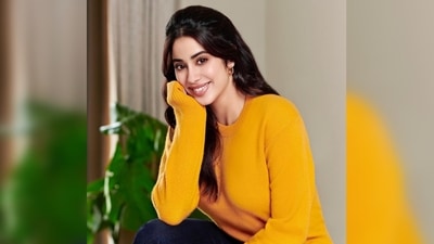 In the last still, Janhvi Kapoor smiled at the camera as she struck a beautiful pose in a bright yellow sweater. (Instagram/@janhvikapoor)