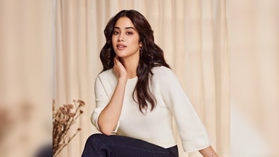 In the first still, Janvi Kapoor can be seen posing in a white sweater that features wide sleeves. (Instagram/@janhvikapoor)