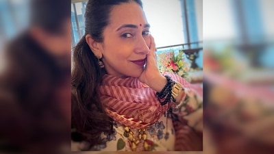 Karisma Kapoor shared a festive selfie looking gorgeous in her contemporary suit paired with jhumkas, bindi and bold maroon lips. (Instagram/@therealkarismakapoor) Karisma Kapoor shared a festive selfie looking gorgeous in her contemporary suit paired with jhumkas, bindi and bold maroon lips. (Instagram/@therealkarismakapoor)