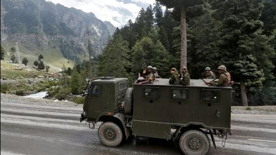Indian army soldiers are seen atop a vehicle on a highway leading to Ladakh, at Gagangeer in Jammu & Kashmir’s Ganderbal district. (REUTERS) Indian army soldiers are seen atop a vehicle on a highway leading to Ladakh, at Gagangeer in Jammu & Kashmir’s Ganderbal district. (REUTERS)