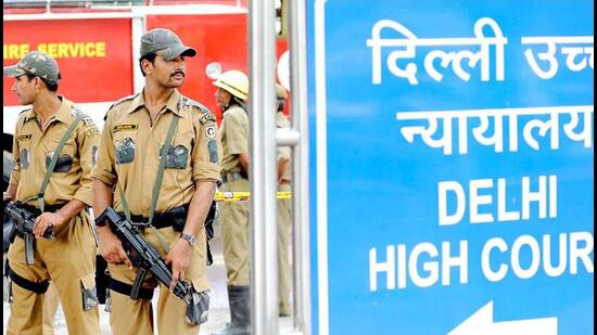 Police commandos stand guard in front of Delhi high court in New Delhi. Police commandos stand guard in front of Delhi high court in New Delhi.