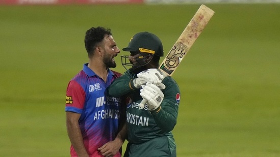 Afghanistan's Fareed Ahmad, left, and Pakistan's Asif Ali, right, react after Ali was dismissed by Ahmad during the T20 cricket match of Asia Cup between Pakistan and Afghanistan, in Sharjah, United Arab Emirates. (AP)