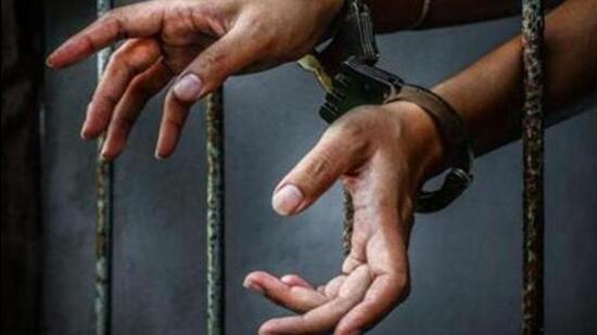 Prisoner in prison with handcuff (Representative image/Getty Images/iStockphoto)