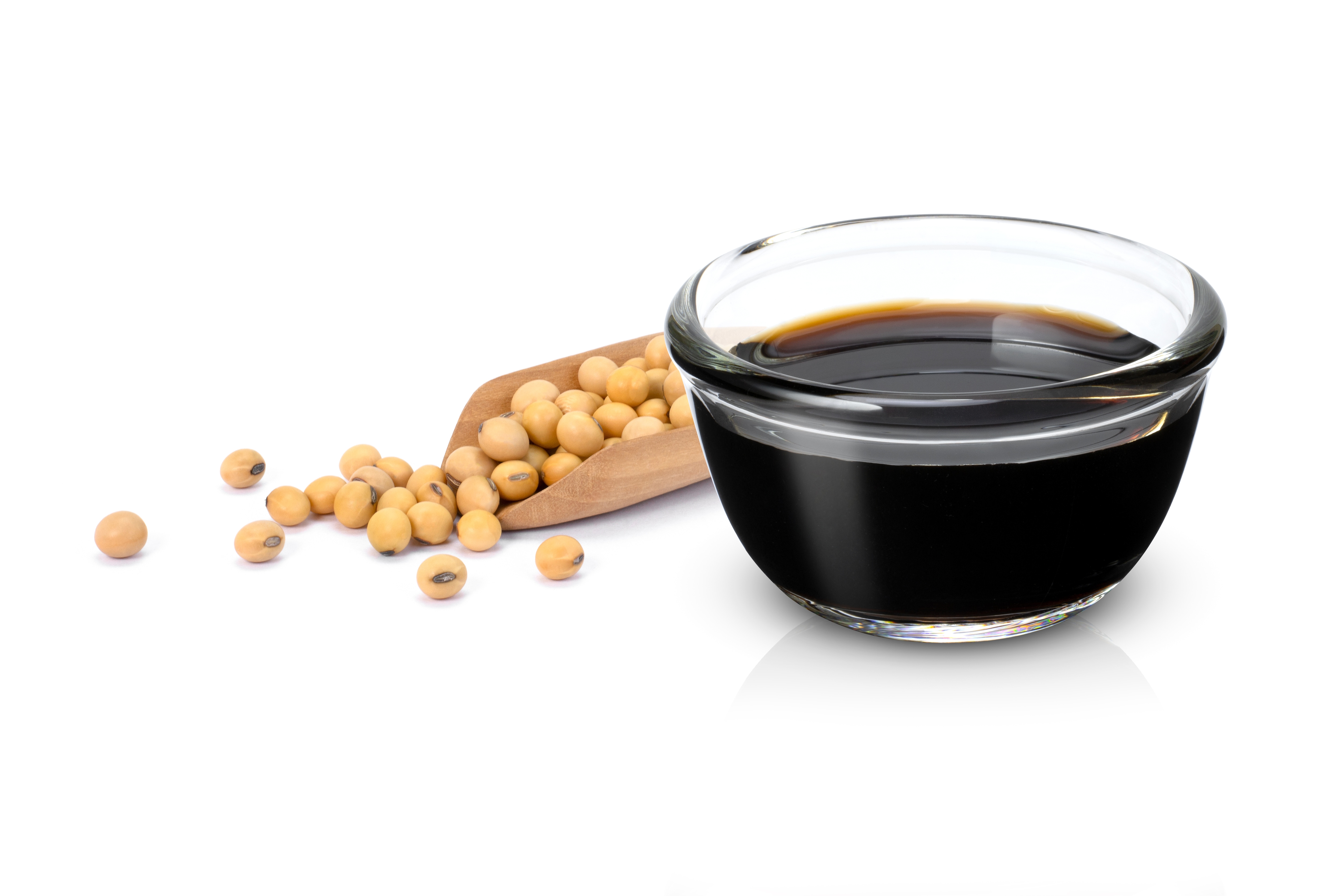 Raw soybean, and the finished soy sauce. (Shutterstock) Raw soybean, and the finished soy sauce. (Shutterstock)